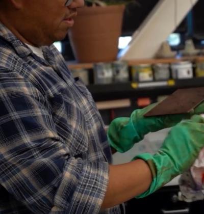 A man works on printmaking